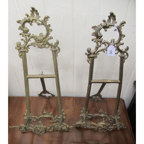 125 - A pair of Victorian style cast brass, table top, easel stands, decorated with C-scrolls and foliate ... 