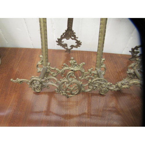 125 - A pair of Victorian style cast brass, table top, easel stands, decorated with C-scrolls and foliate ... 