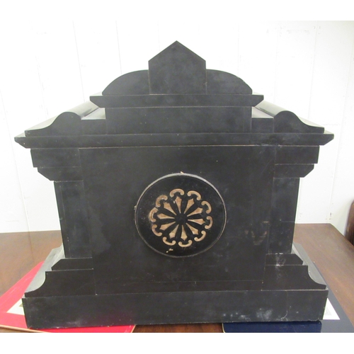 218 - A late Victorian black slate cased mantel clock of breakfront, architectural form; the movement face... 