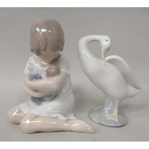 100 - Four Lladro porcelain figures; and another by Royal Copenhagen, a little girl holding a doll  4