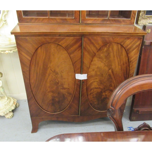 114 - An Edwardian string inlaid, crossbanded and mahogany veneered display cabinet with a pair of glazed ... 