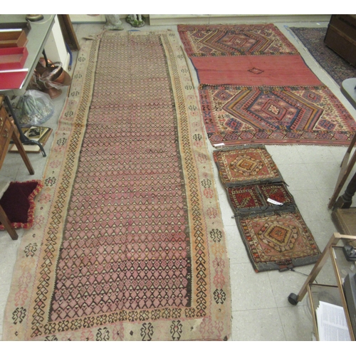 123 - Three rugs: to include a (probably) North African example, decorated with repeating designs in brigh... 