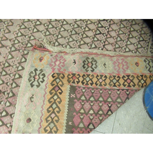 123 - Three rugs: to include a (probably) North African example, decorated with repeating designs in brigh... 