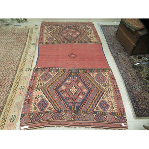 123 - Three rugs: to include a (probably) North African example, decorated with repeating designs in brigh... 