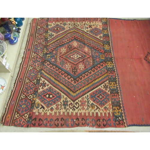 123 - Three rugs: to include a (probably) North African example, decorated with repeating designs in brigh... 