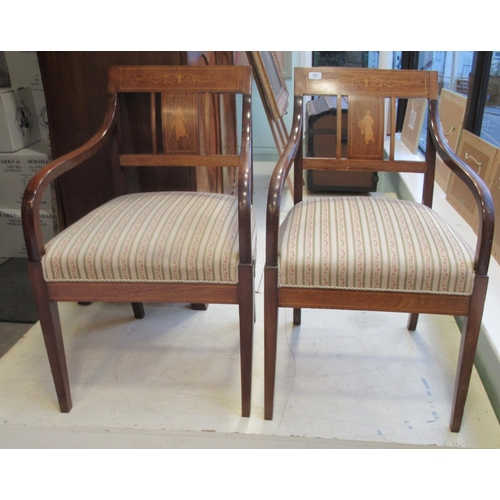 127 - A pair of Edwardian string inlaid and marquetry mahogany framed open arm chairs, the later floral pa... 