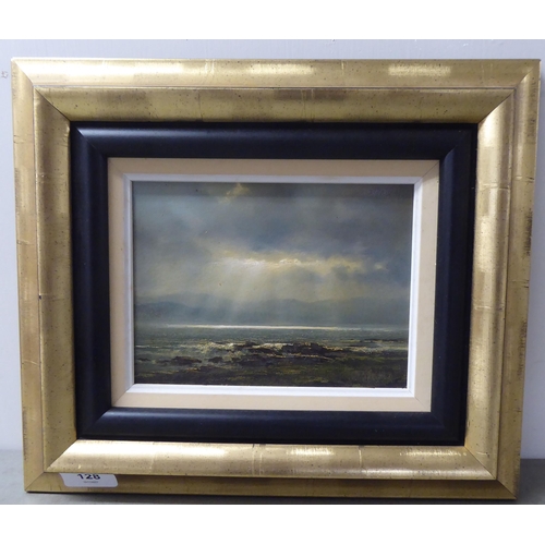 128 - 20thC British School - a seascape with sunlight breaking through clouds  oil on board  bea... 