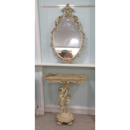 135 - A modern Italianate inspired oval mirror, decorated with cherubic figures and other ornament  3... 