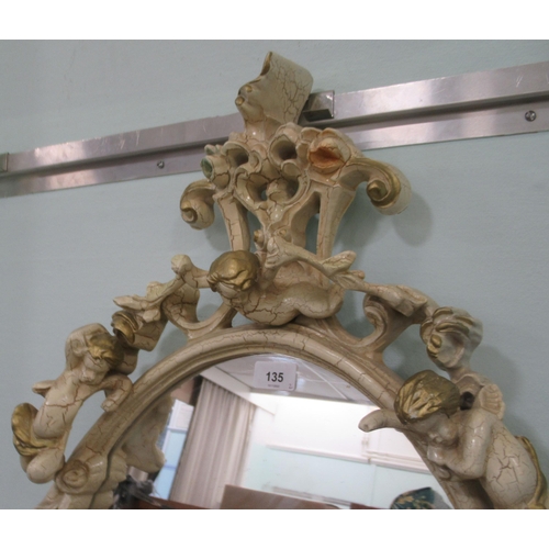 135 - A modern Italianate inspired oval mirror, decorated with cherubic figures and other ornament  3... 