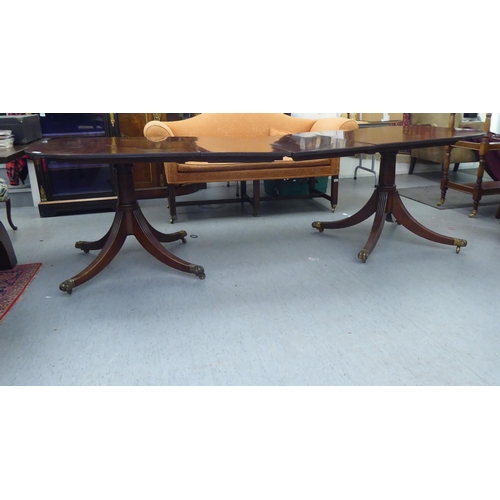 142 - An early 20thC reproduction of a Regency twin pedestal dining table  29