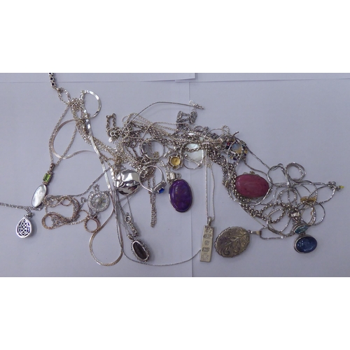 147 - Silver and white metal items of personal ornament: to include pendants on fine neckchains, set with ... 