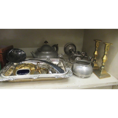 15 - A mixed lot: to include an Arts & Crafts period three piece spot hammered pewter tea set; a pair... 