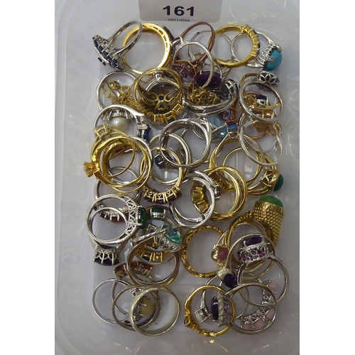 161 - Silver gilt and other dress rings, set with white and coloured stones 