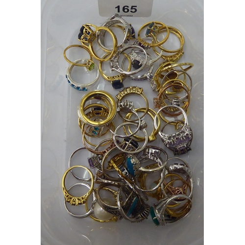 165 - Silver gilt and other dress rings, set with white and coloured stones 