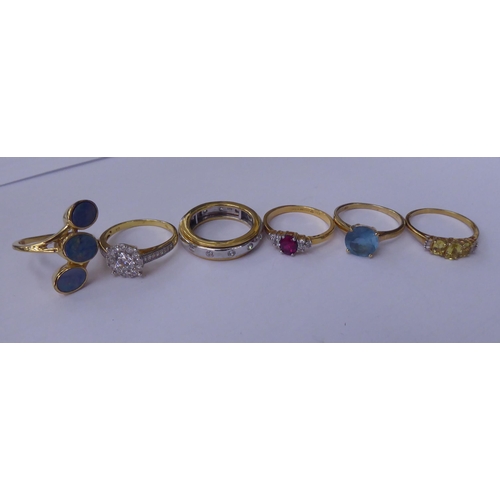 165 - Silver gilt and other dress rings, set with white and coloured stones 