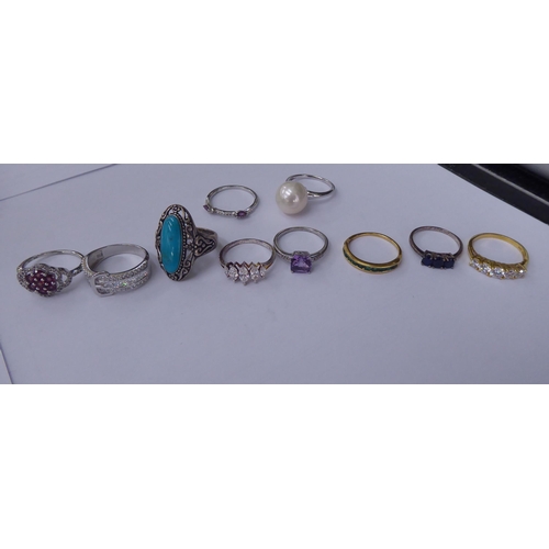 165 - Silver gilt and other dress rings, set with white and coloured stones 