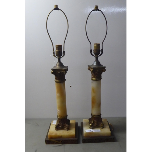 172 - A pair of Continental style table lamps, fashioned in onyx and lacquered brass with Corinthian colum... 