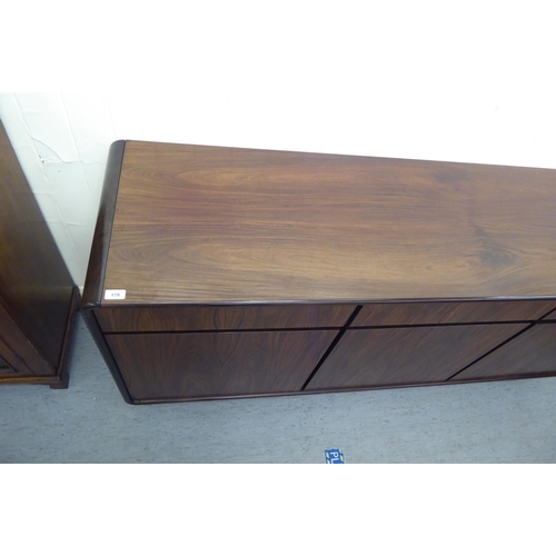 179 - A modern rosewood effect sideboard with three frieze drawers, over three doors, on a plinth  33