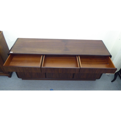 179 - A modern rosewood effect sideboard with three frieze drawers, over three doors, on a plinth  33