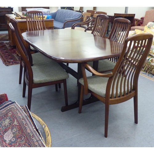 180 - A modern rosewood effect twin pedestal dining table, the top with round corners, raised on splayed s... 