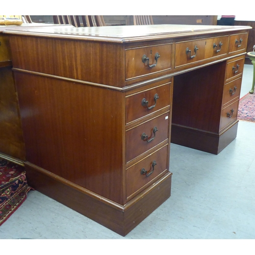 190 - A modern mahogany finished nine drawer twin pedestal desk  30