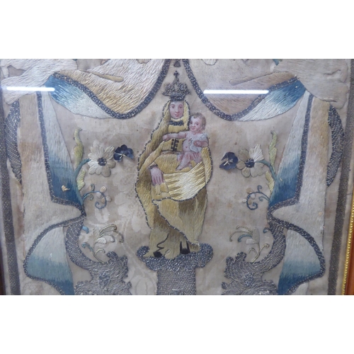 191 - An early 19thC coloured silk and white metal thread embroidered picture, featuring The Virgin & ... 