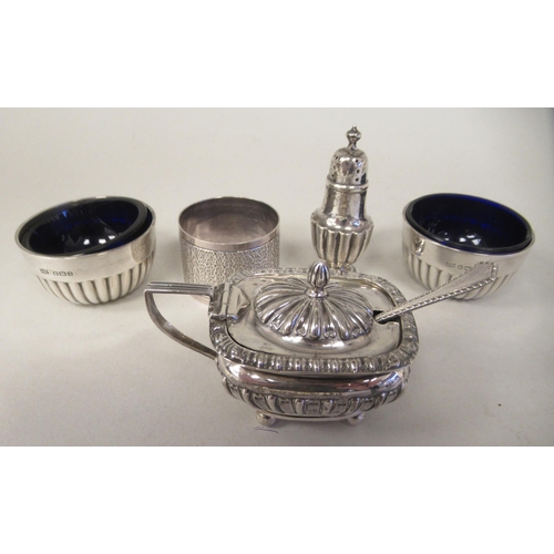 20 - Silver items, viz. a pair of demi-reeded salt cellars with blue glass liners; a lidded reeded and fl... 