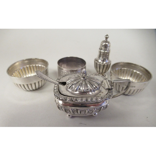 20 - Silver items, viz. a pair of demi-reeded salt cellars with blue glass liners; a lidded reeded and fl... 