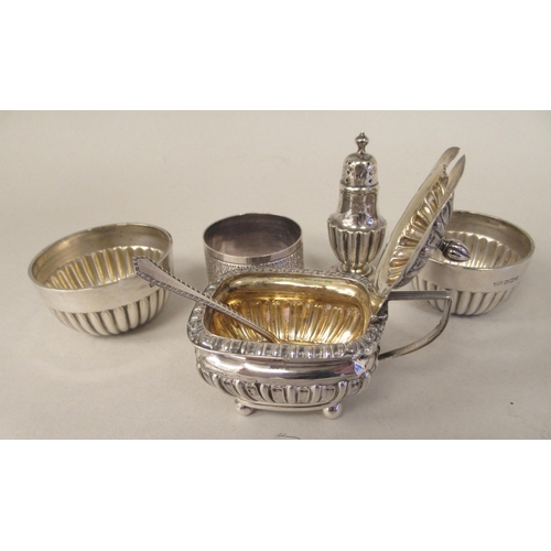 20 - Silver items, viz. a pair of demi-reeded salt cellars with blue glass liners; a lidded reeded and fl... 