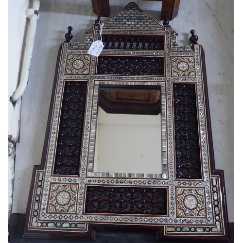 201 - An early/mid 20thC Indian brass inlaid fruitwood octagonal occasional table, on a folding underframe... 