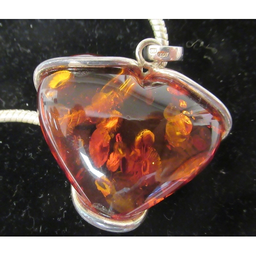 211 - A Pandora white metal necklace with a heart shaped, amber coloured stone