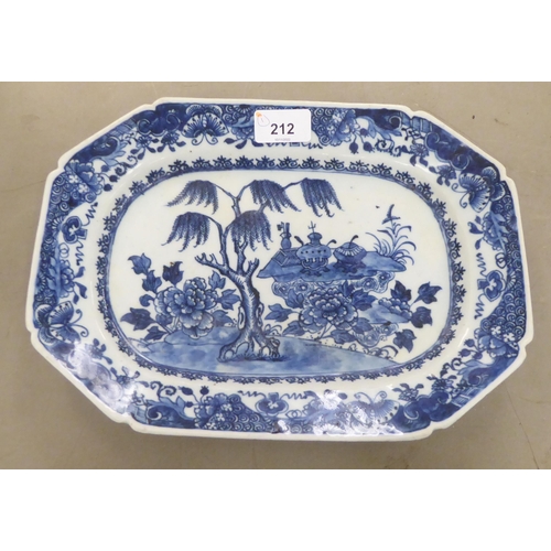 212 - A late 18thC Chinese porcelain plate of elongated, octagonal form, decorated in blue and white ... 