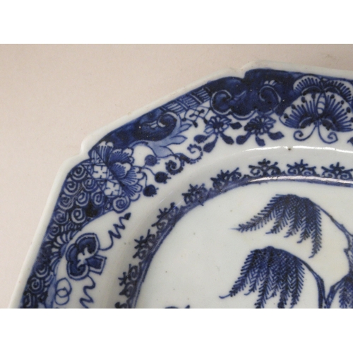 212 - A late 18thC Chinese porcelain plate of elongated, octagonal form, decorated in blue and white ... 