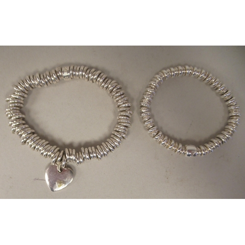 227 - Two Links of London silver bracelets, on elasticated straps, in one box