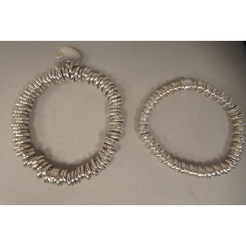 227 - Two Links of London silver bracelets, on elasticated straps, in one box