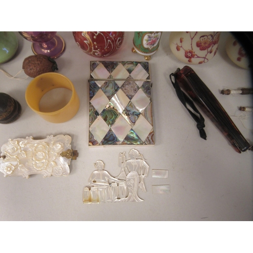 228 - Small 20thC collectables: to include a mother-of-pearl card case