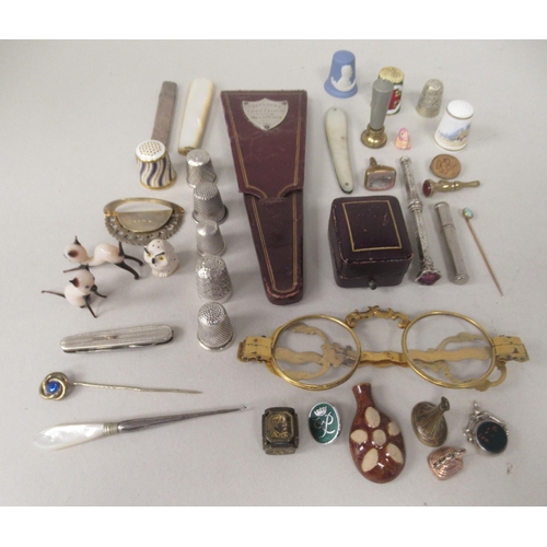 230 - 19thC and later collectables: to include a pair of gilt metal spectacles; silver and other thimbles