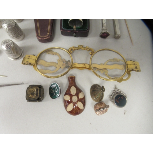 230 - 19thC and later collectables: to include a pair of gilt metal spectacles; silver and other thimbles