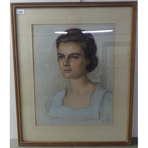 235 - Mid 20thC British School - a portrait of a young woman  pastel  bears an indistinct signat... 