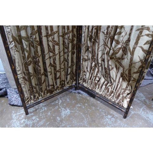 236 - A 20thC painted bamboo effect framed two-fold dressing room screen with fabric curtains  66