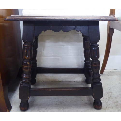 237 - An early 20thC oak joint stool, raised on turned and fluted legs, united by stretchers