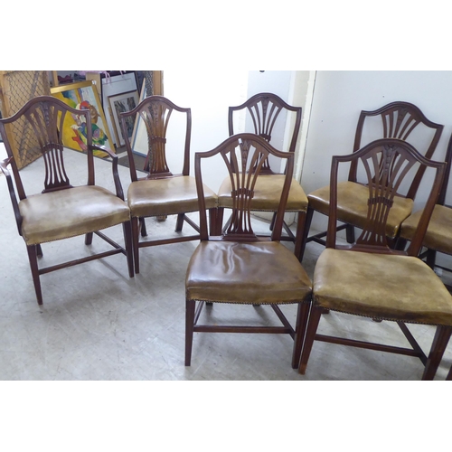 238 - A set of twelve early 20thC Hepplewhite design, mahogany framed dining chairs, the stud upholstered ... 