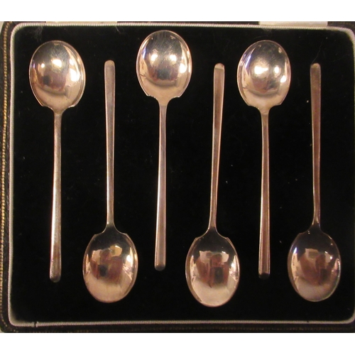 24 - A set of six silver teaspoons; a set of six bean and coffee spoons; and another set of six of plain ... 