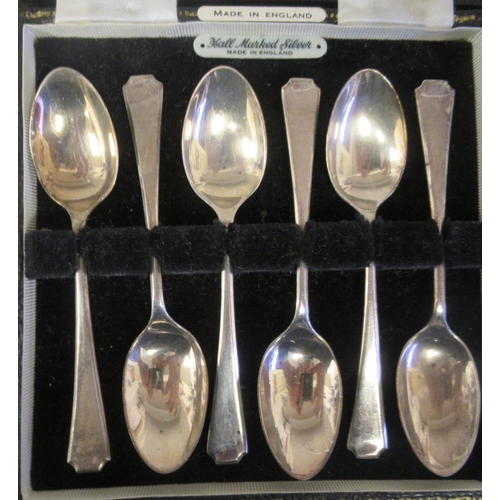 24 - A set of six silver teaspoons; a set of six bean and coffee spoons; and another set of six of plain ... 