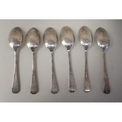 24 - A set of six silver teaspoons; a set of six bean and coffee spoons; and another set of six of plain ... 