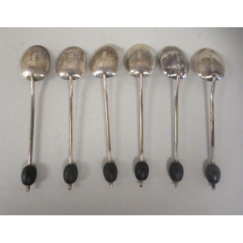 24 - A set of six silver teaspoons; a set of six bean and coffee spoons; and another set of six of plain ... 