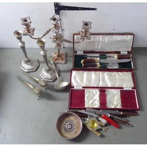 240 - Silver plated and white metal tableware: to include a pair of candlesticks  12