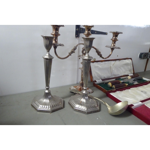 240 - Silver plated and white metal tableware: to include a pair of candlesticks  12