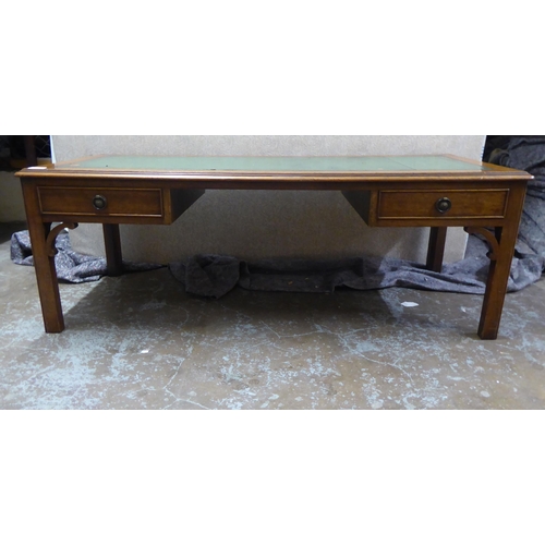 249 - A 20thC Georgian design mahogany framed coffee table, fashioned as a two drawer kneehole desk, raise... 