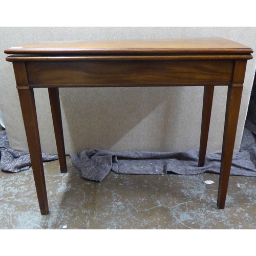 253 - A Regency mahogany foldover card table, raised on square legs  29